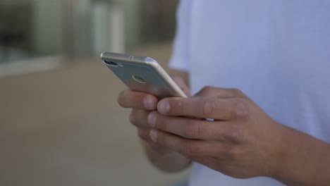 Closeup-shot-of-male-hands-using-smartphone.